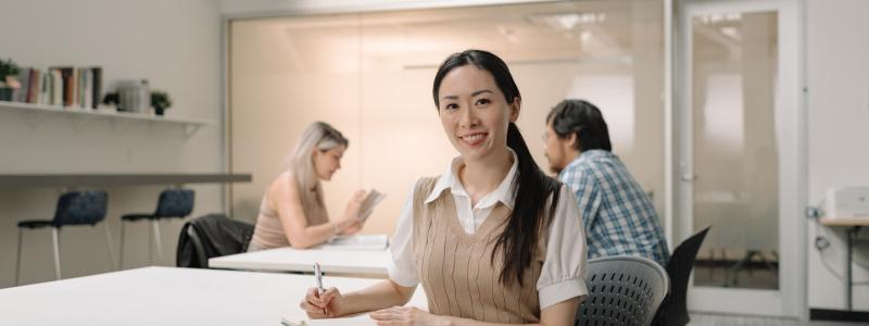 Student looking at camera and smiling