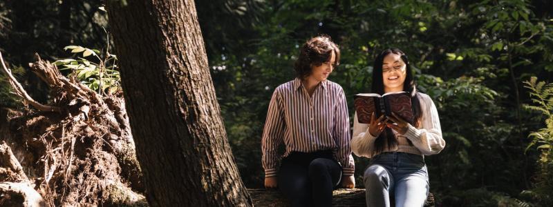 Students reading the Bible in the Back 40