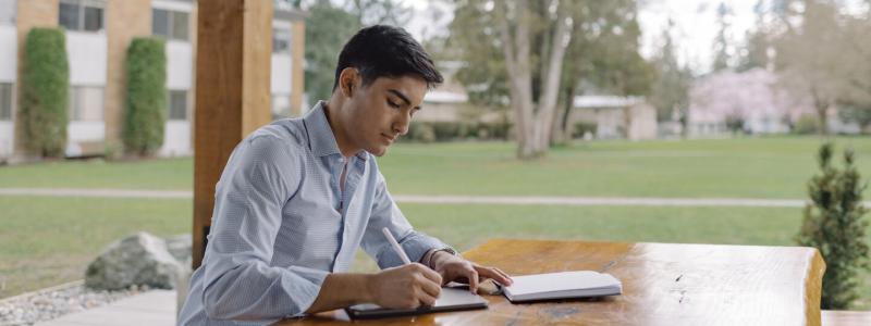 A student studying outside