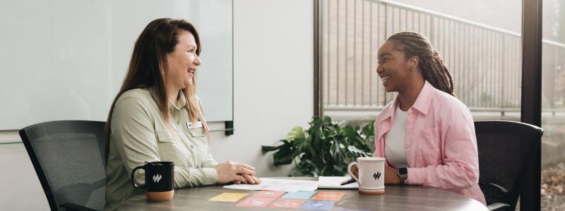 Two people in a meeting.