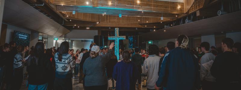 People Worshipping and singing.
