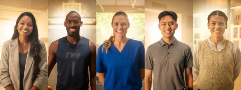 Five diverse people standing indoors, smiling warmly at the camera.