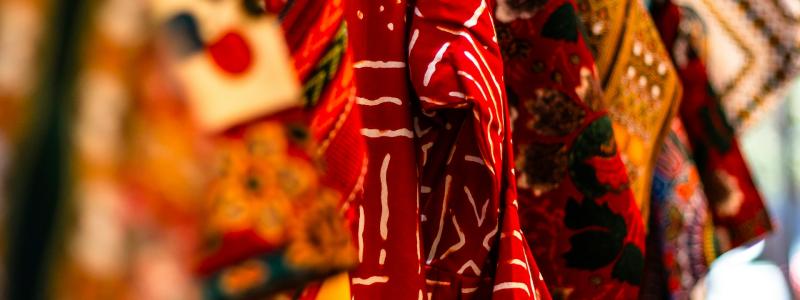 African textiles hanging from a beam