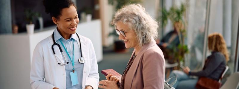 Happy senior woman going through her medical data