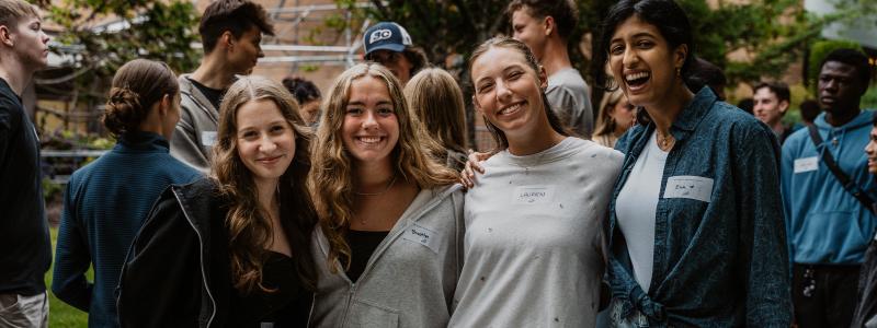 Students posing together outdoors during Orientation.