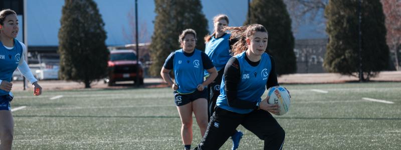 TWU girl students playing Rugby in the field