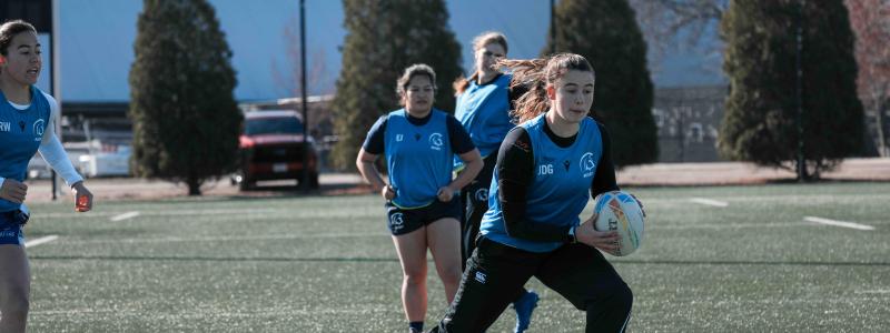 TWU girl students playing Rugby in the field