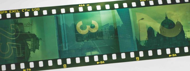 Film strip displaying a series of photographic frames, representing cinema and visual storytelling.
