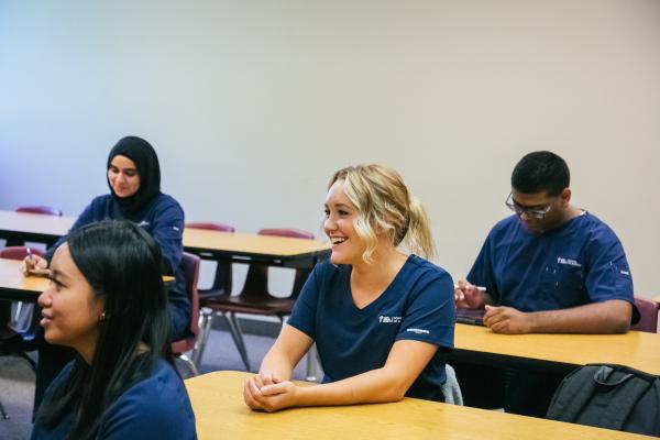 Nursing students in classroom at desks