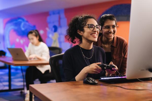 students playing a video game in a lab