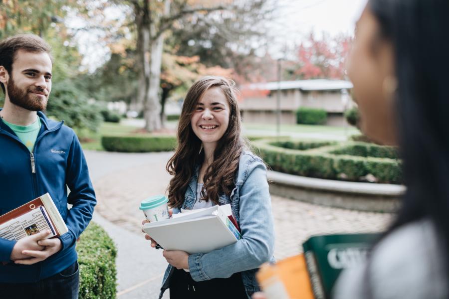 Students talking on campus.