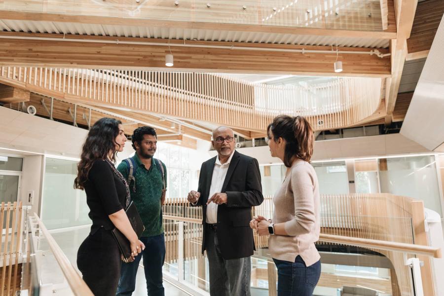 people talking in Kuhn Centre atrium