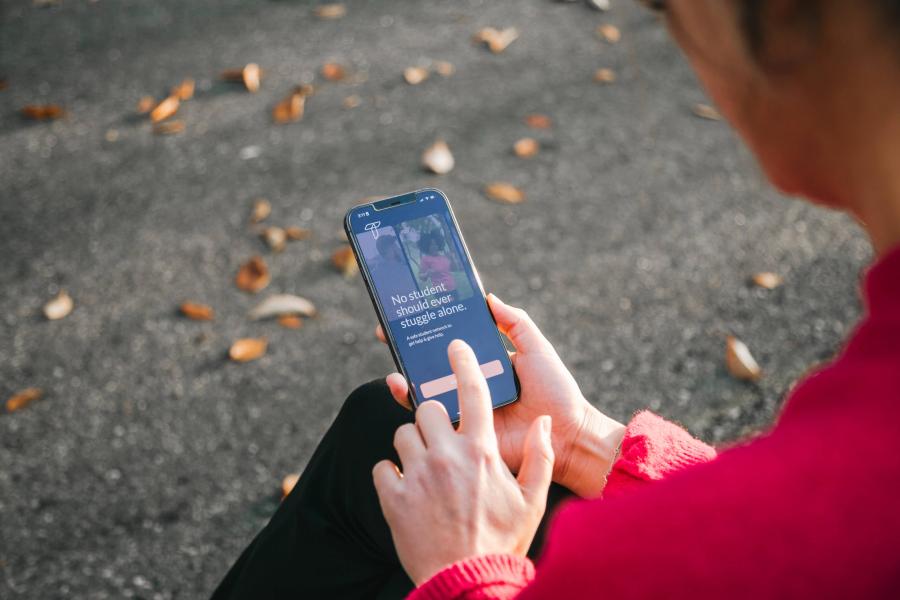 person looking at iphone