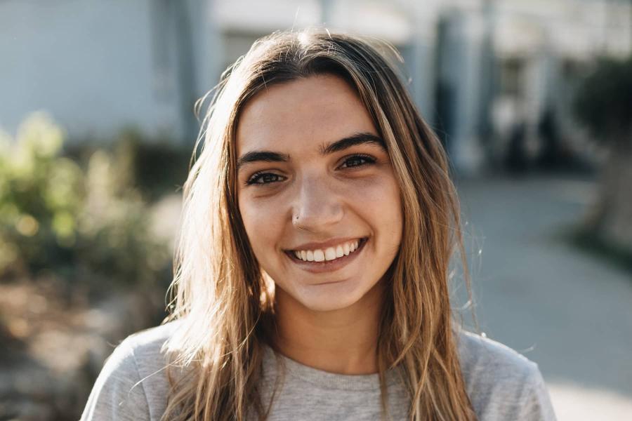 woman outside smiling at camera