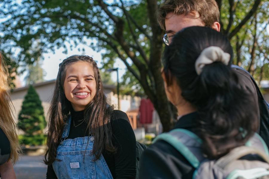 women smiling and looking at other people