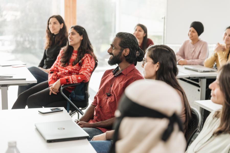 international students smiling in a classroom