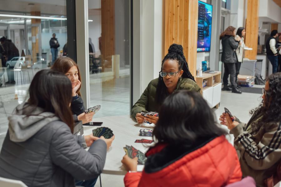 students playing cards at a table