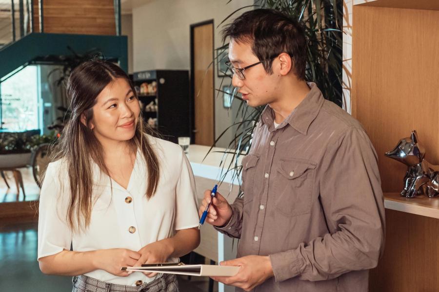 people talking in an office setting