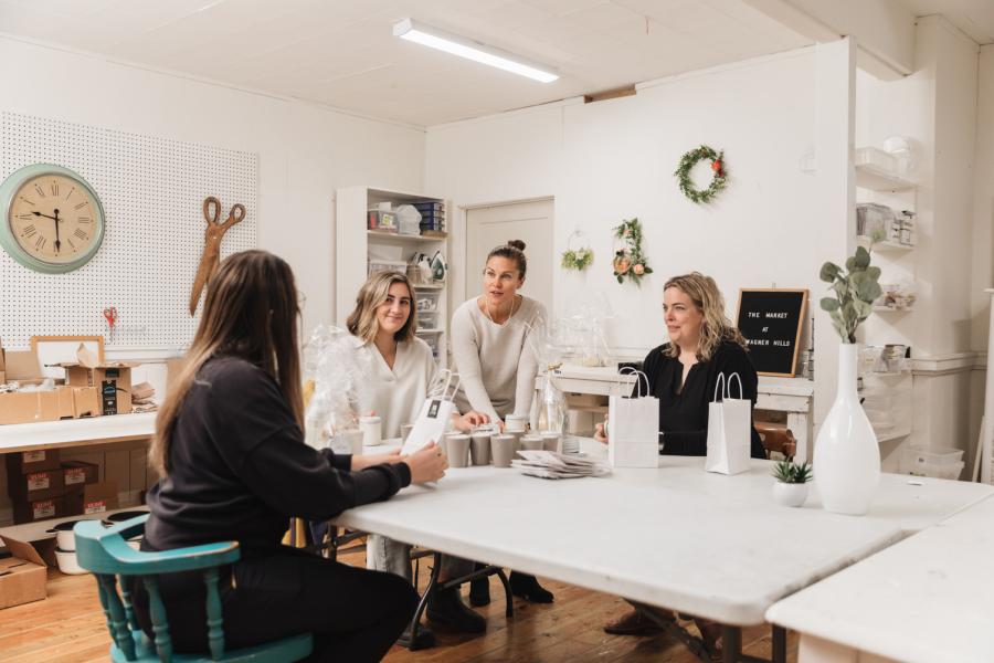 A group of women helping out at a store