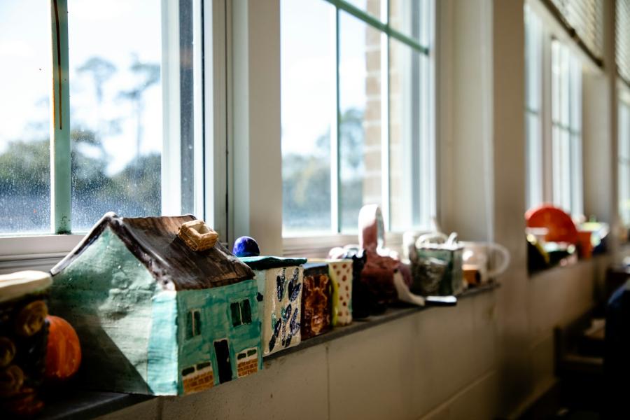 Colorful clay models on a windowsill.