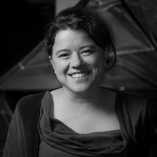 women smiling towards the camera in black and white