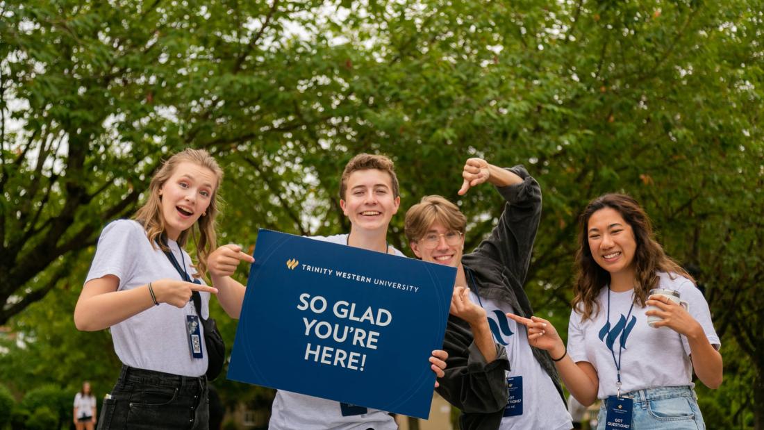 students holding welcome sign