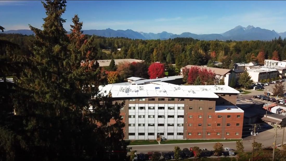 Jacobson Hall on Langley Campus with mountains in the background
