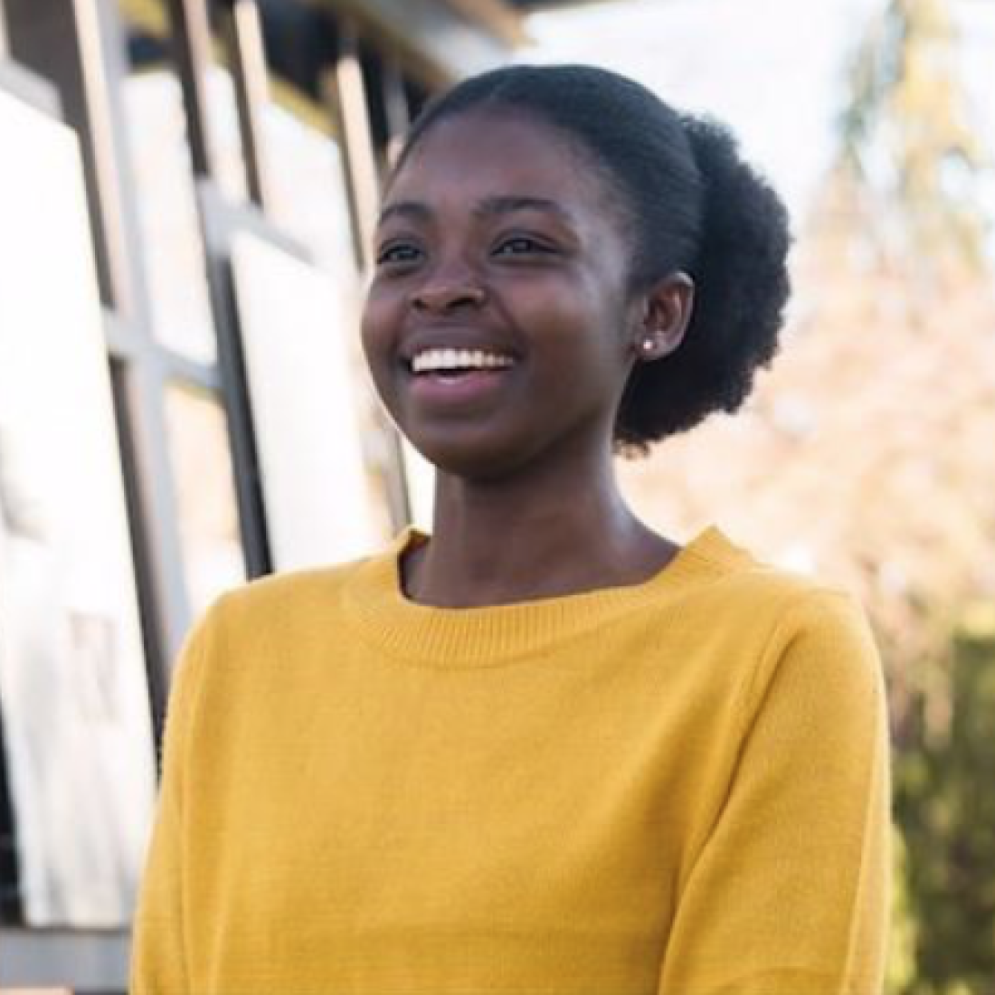 student smiling at the camera