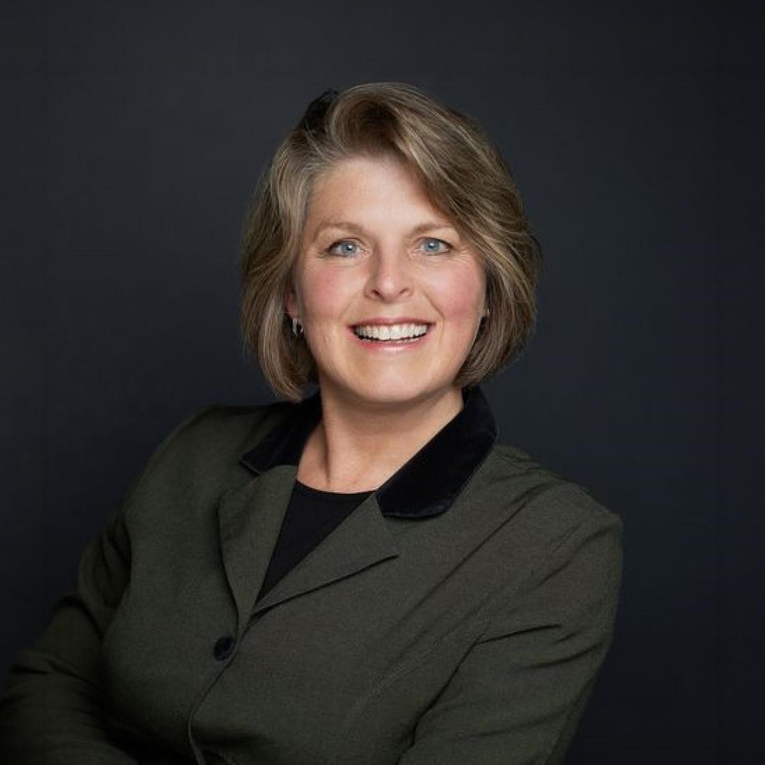 Headshot of Dr. Rosemary Flaaten in front of a black background