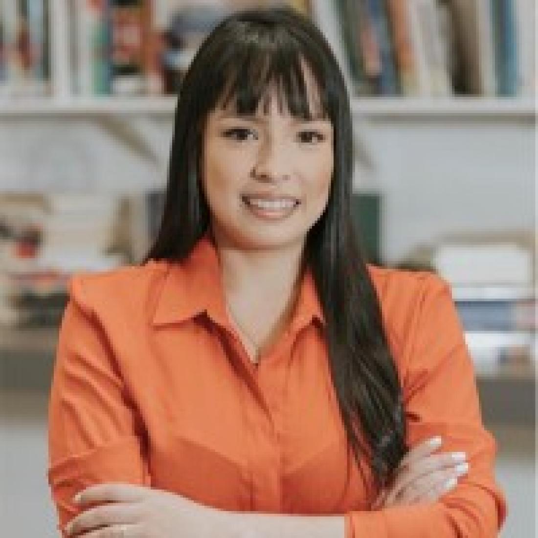 Tatiana Ortiz in a professional attire looking at the camera with a smile
