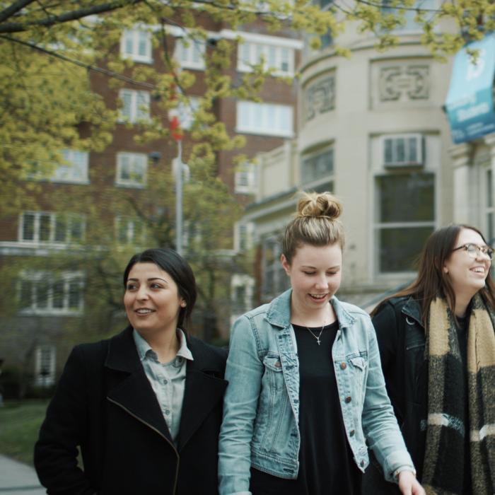 Four students walking in Ottawa at the Laurentian Leadership Centre (LLC).