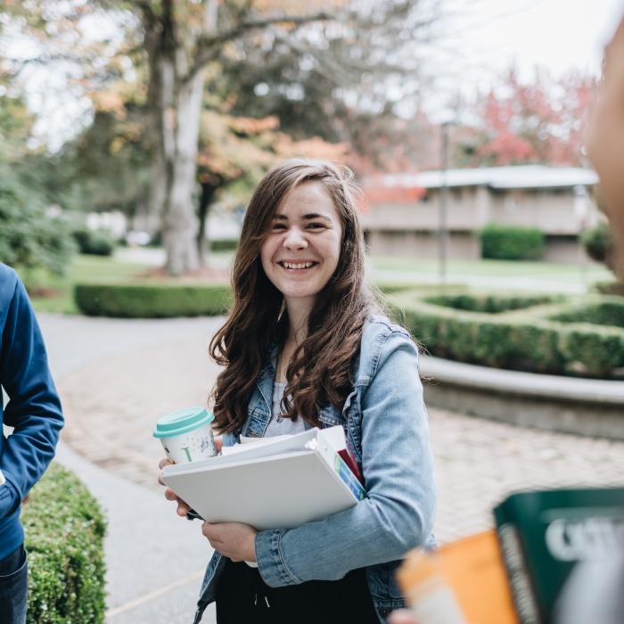 Students talking on campus.