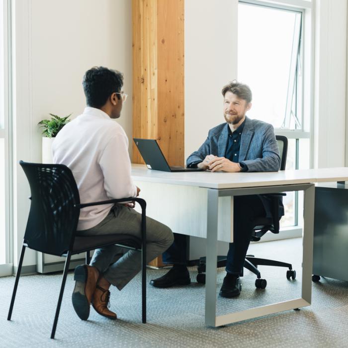 student meeting with staff member