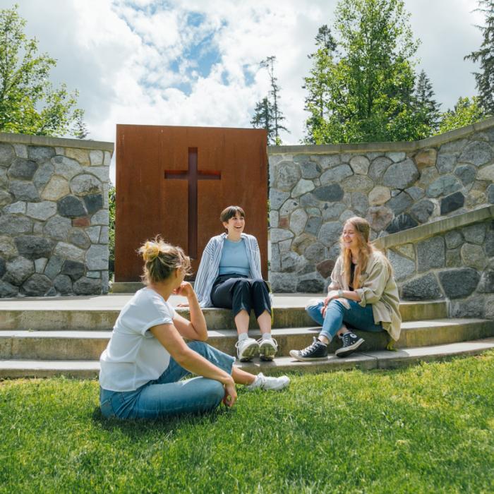students sitting on the Hanson Outdoor Chapel