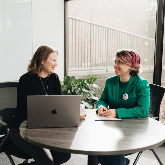 two people having a seated conversation 