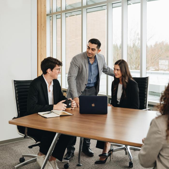 business students in classroom having a discussion