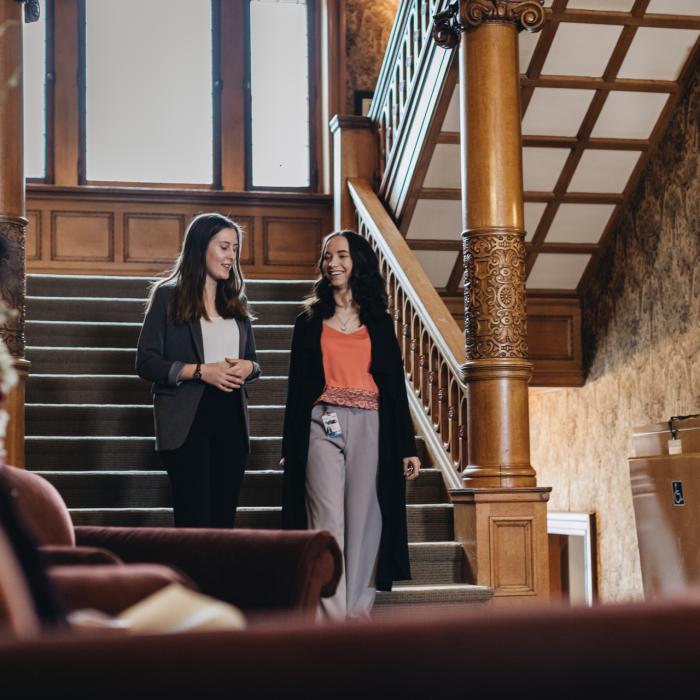 students walking down the stairs while having a conversation