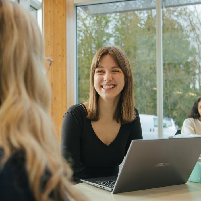 student leader smiling and talking