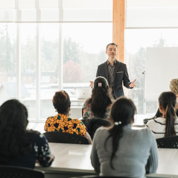 international students in classroom learning from professor