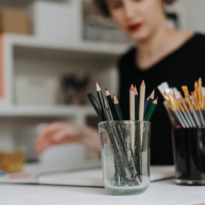 girl at table with art supplies