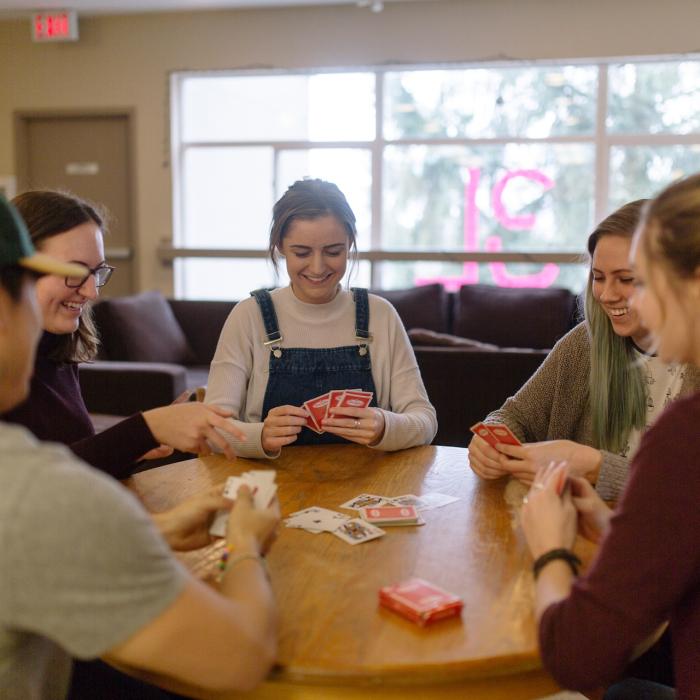 students playing cards at a table
