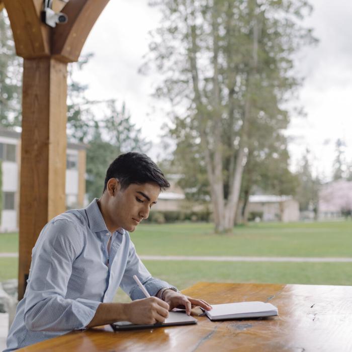A student studying outside