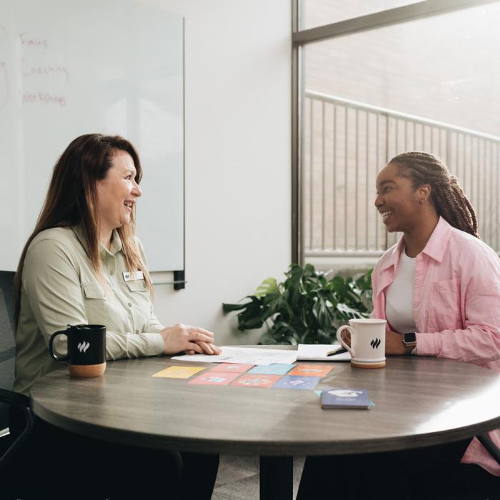 Two people in a meeting.
