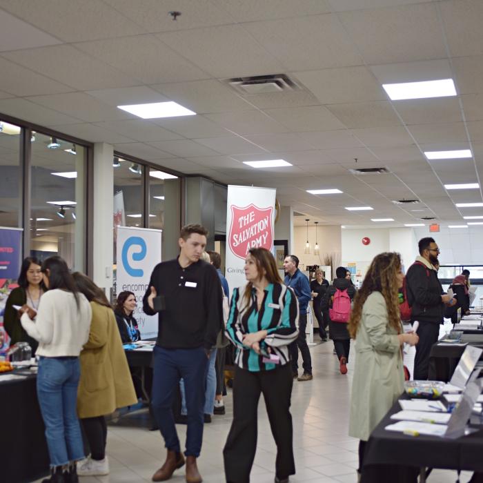 People walking down the hallway at Career Fair