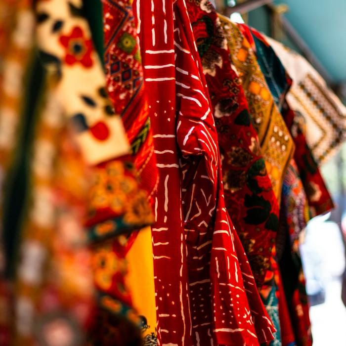 African textiles hanging from a beam