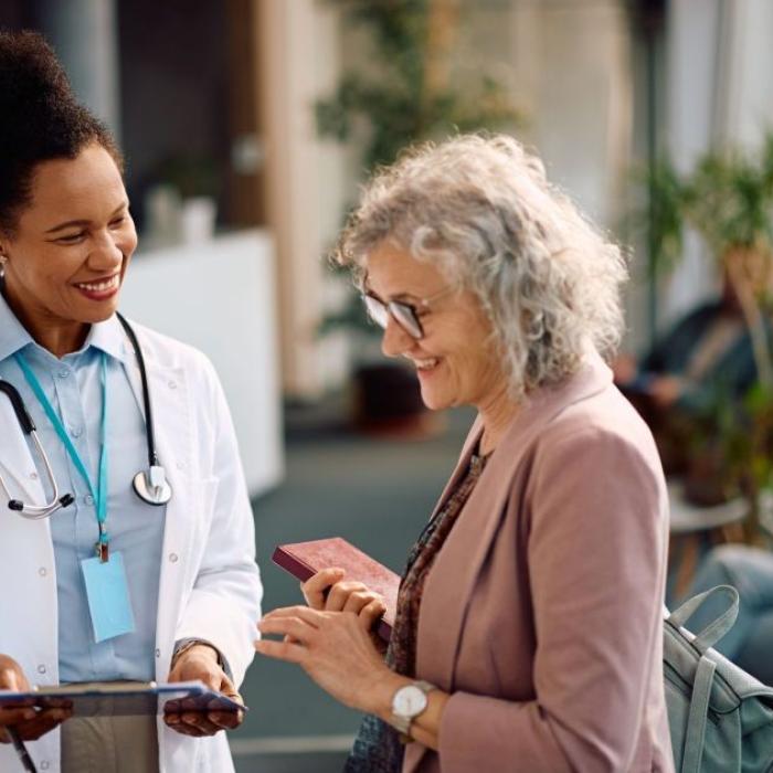Happy senior woman going through her medical data