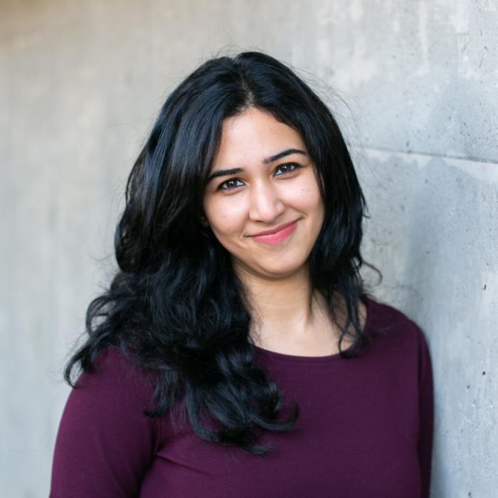 Ishleen Gandhi in front of a grey wall