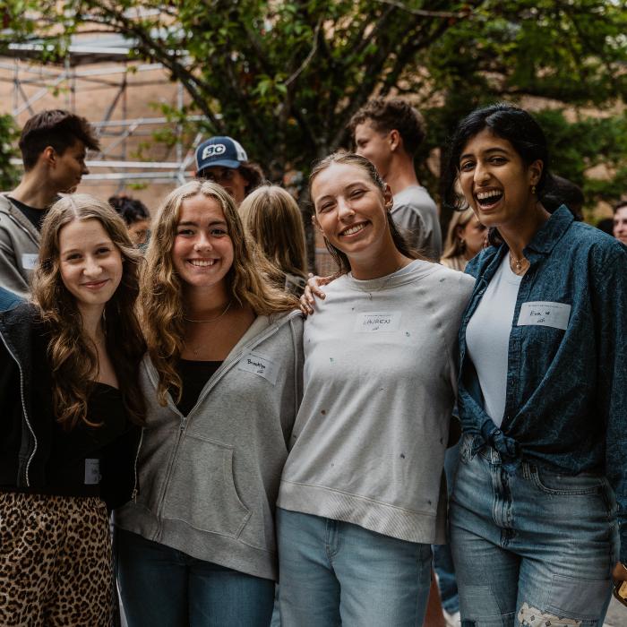 Students posing together outdoors during Orientation.