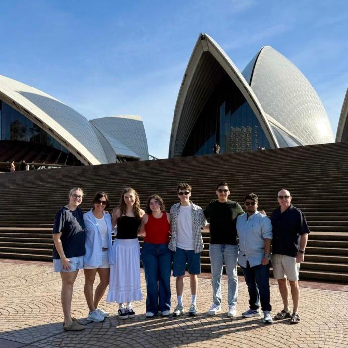 Group of students standing in front of the Sydney Opera House.