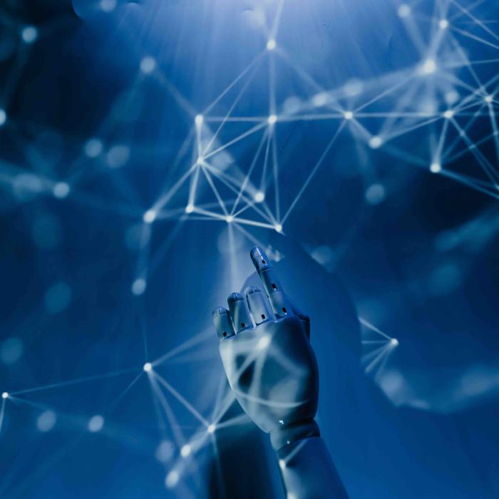 Hand interacting with a digital network of connected points and lines, representing artificial intelligence and data technology.